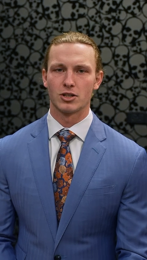 Tyson Bagent wore a blue suit from Balani Custom Suits.